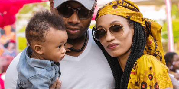 photo of Di' Ja and Rotimi with their baby boy in 2016